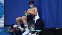 Thomas Daley of Team Great Britain is seen knitting before the Men's 10m Platform Final on day fifteen of the Tokyo 2020 Olympic Games