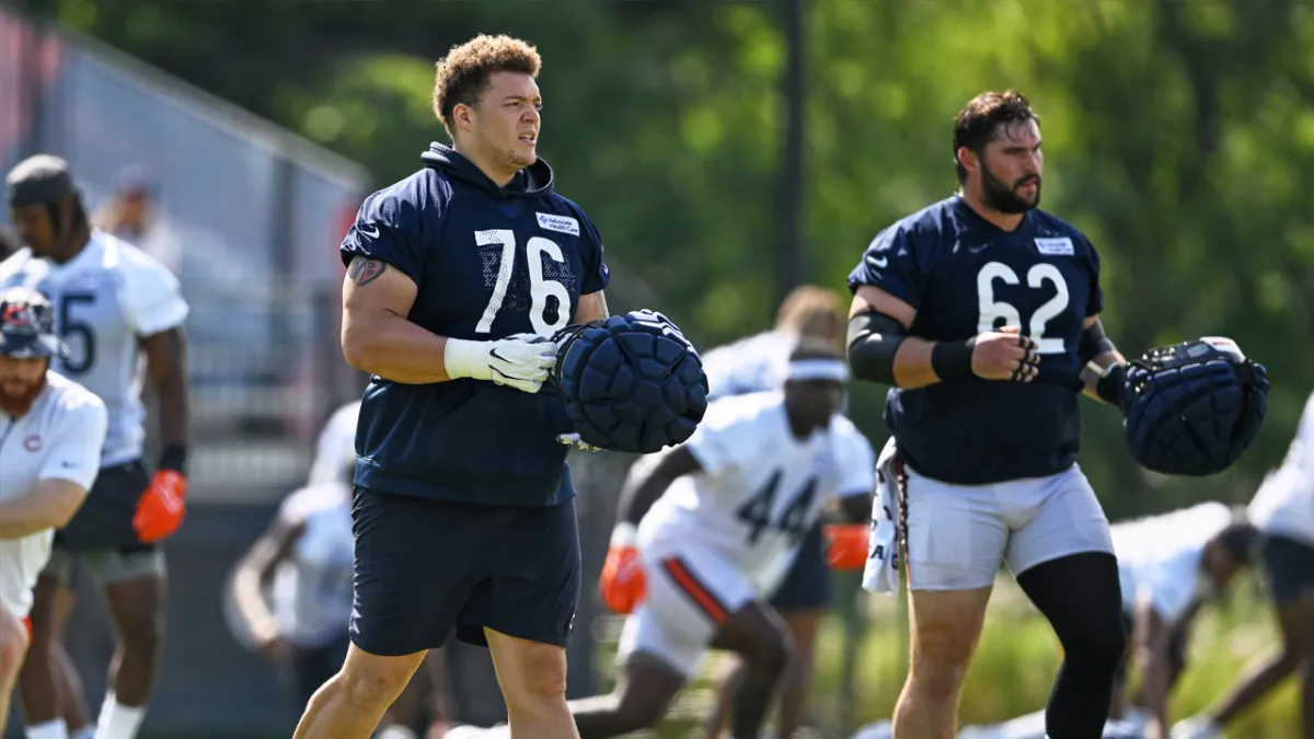 Chicago Bears offensive tackle Teven Jenkins (76) runs off the