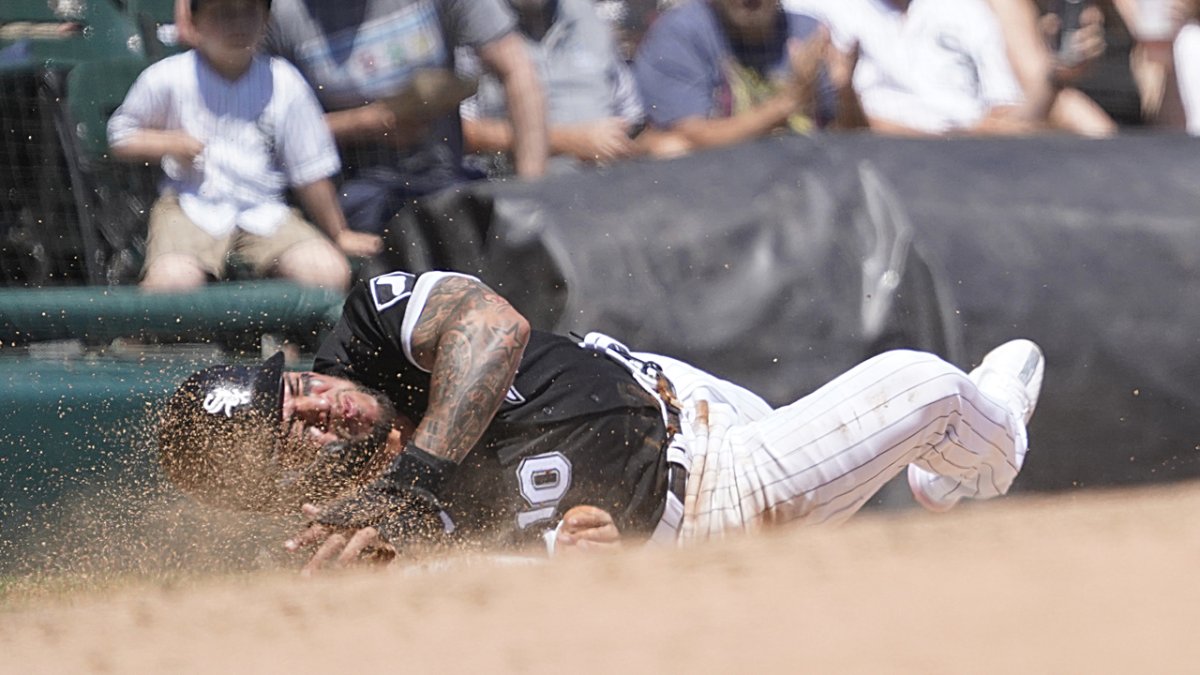 What a catch! White Sox third baseman Yoan Moncada hangs onto a