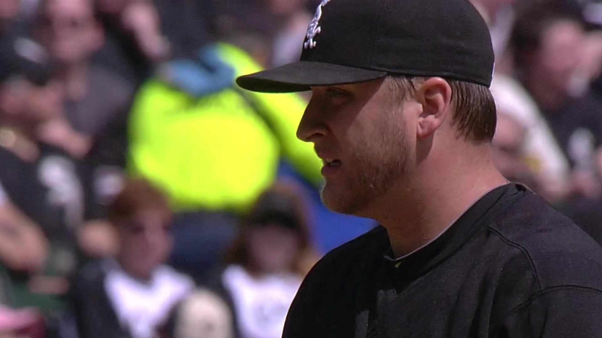 Minnesota Twins' Joe Crede stands on the field after flying out to