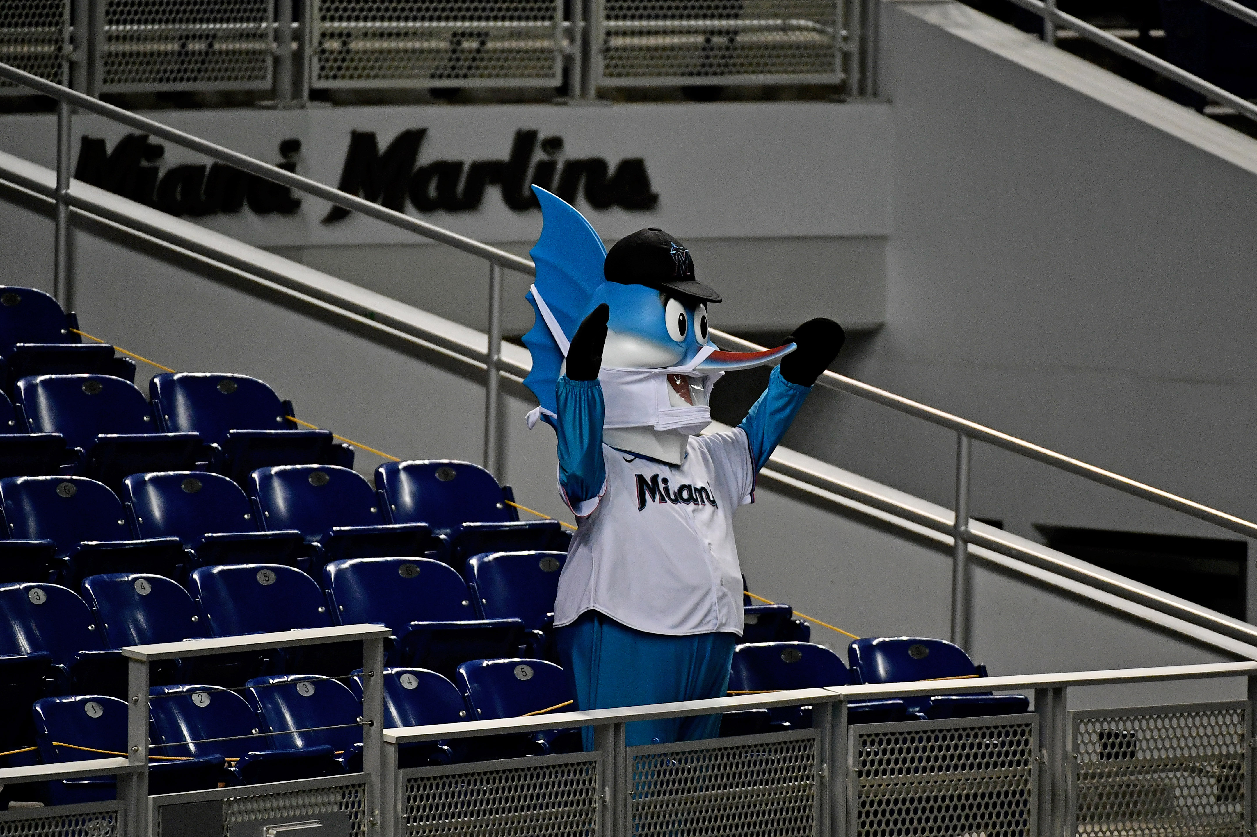 The Miami Marlins mascot, Billy the Marlin, high fives fans prior to the  start of the 2023 MLB