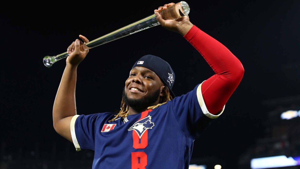 Baseball Hall of Famer Vladimir Guerrero, right, hugs Washington