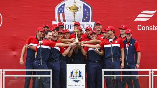 Members of the U.S. Team smile with the trophy following their 19-9 victory in the 43rd Ryder Cup at Whistling Straits on September 26, 2021 in Sheboygan, Wisconsin.