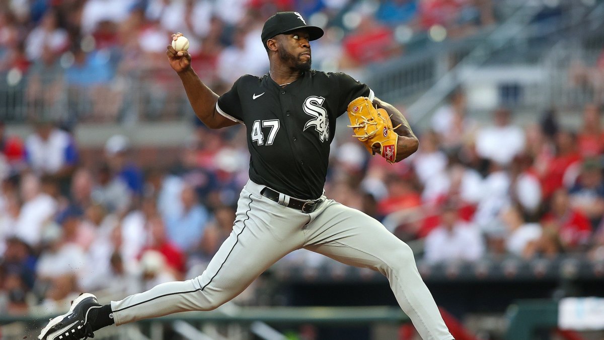 Touki Toussaint of the Chicago White Sox talks with pitching coach