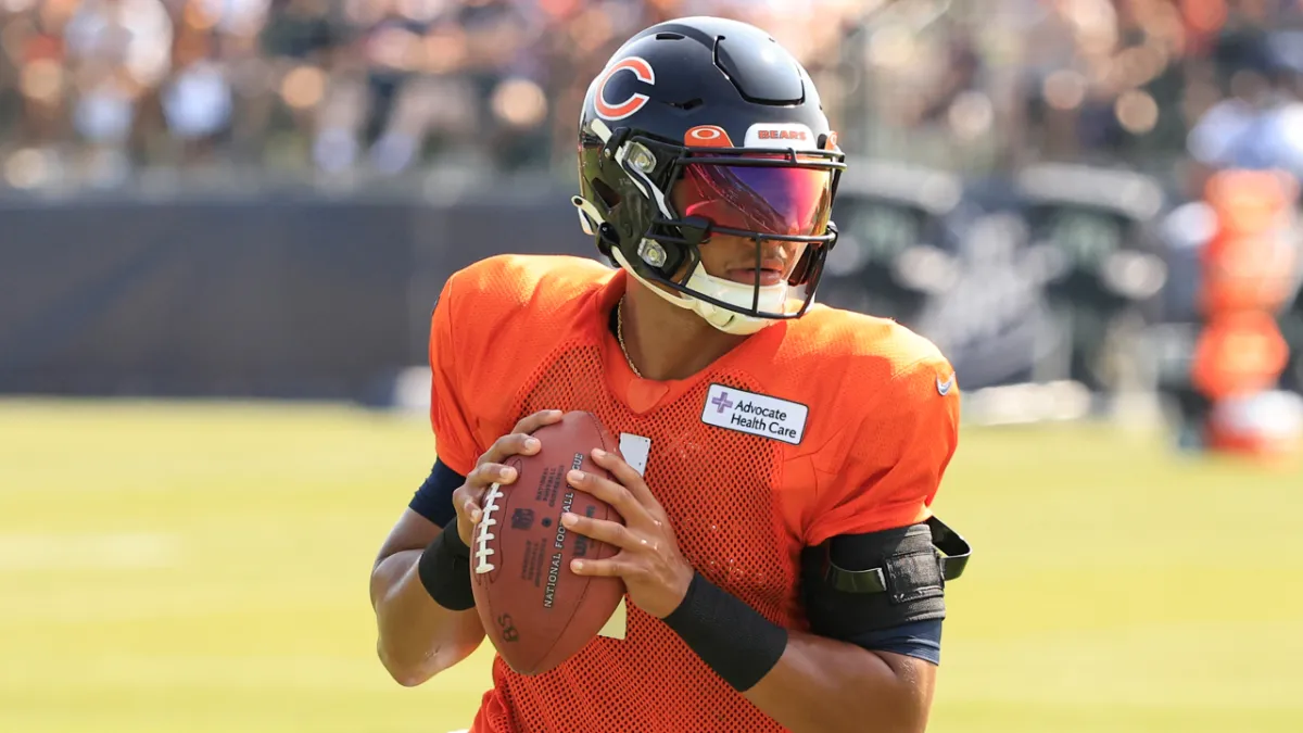 Justin Fields of the Chicago Bears takes part in a drill during