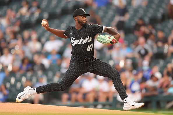 Touki Toussaint of the Chicago White Sox talks with pitching coach