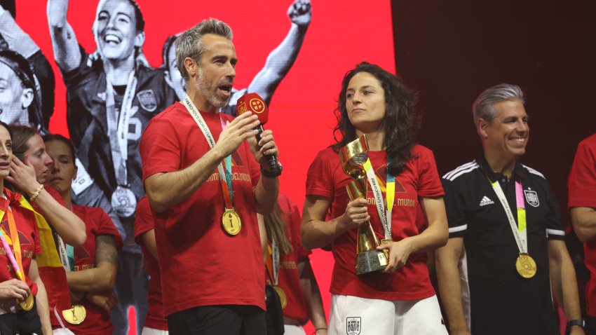 Jorge Vilda on stage holding microphone