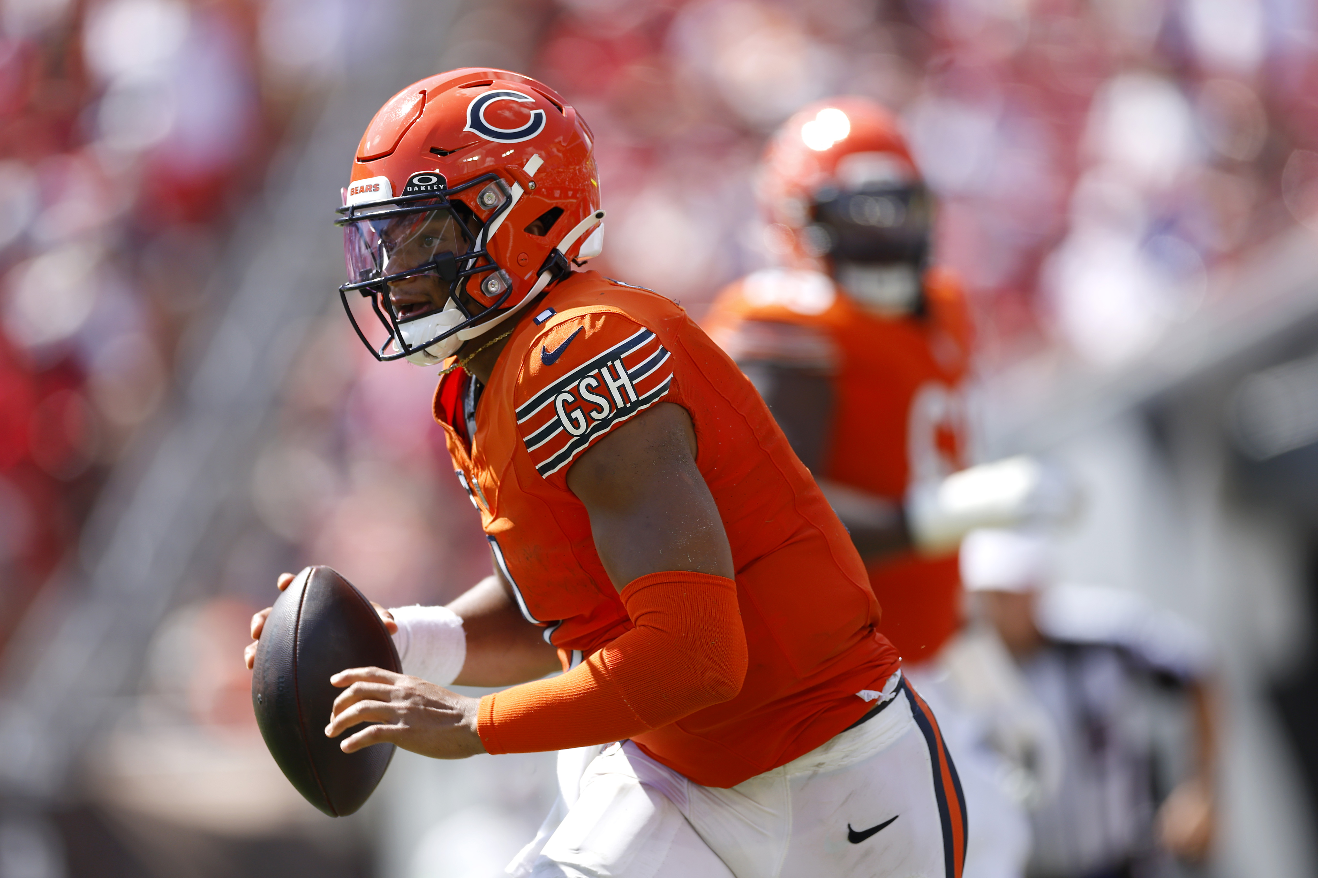 Justin Fields of the Chicago Bears reacts after a play during the News  Photo - Getty Images