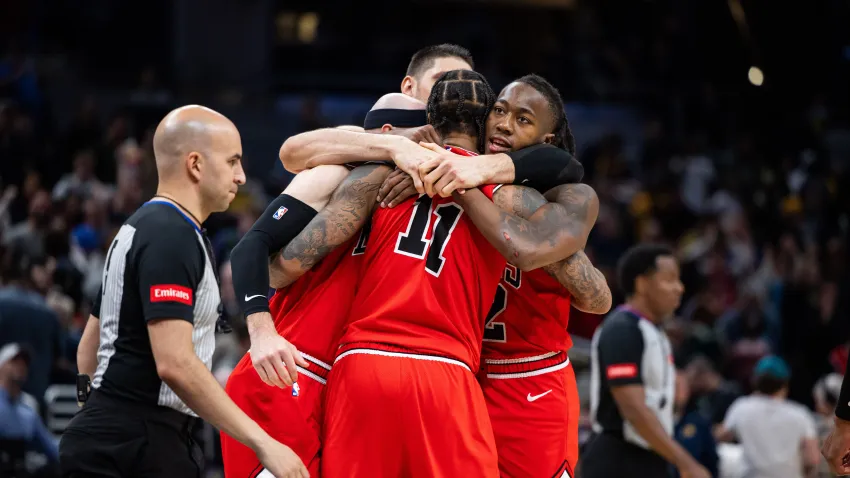 Mar 13, 2024; Indianapolis, Indiana, USA; Chicago Bulls team hug after beating the Indiana Pacers in overtime at Gainbridge Fieldhouse. Mandatory Credit: Trevor Ruszkowski-USA TODAY Sports