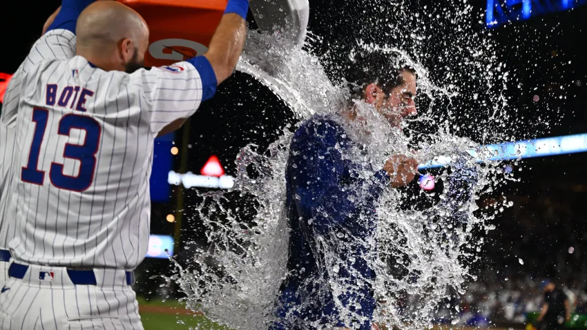 CHICAGO, IL – JUNE 05:  Mike Tauchman #40 of the Chicago Cubs is doused with water by David Bote #13 after hitting a walk off home run in the ninth inning to defeat the Chicago White Sox 7-6 at Wrigley Field on June 05, 2024 in Chicago, Illinois.  (Photo by Jamie Sabau/Getty Images)