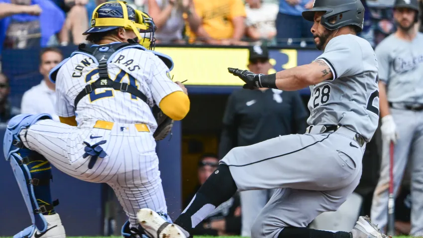 Jun 2, 2024; Milwaukee, Wisconsin, USA; Milwaukee Brewers catcher William Contreras (24) tags out Chicago White Sox left fielder Tommy Pham (28) trying to score in the eighth inning at American Family Field. Mandatory Credit: Benny Sieu-USA TODAY Sports