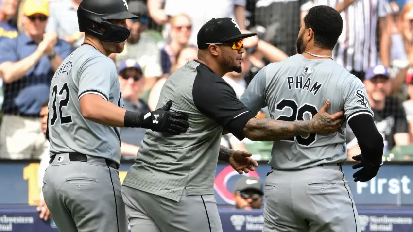 Jun 2, 2024; Milwaukee, Wisconsin, USA; Chicago White Sox left fielder Tommy Pham (28) is restrained by teammates after exchanging words with Milwaukee Brewers catcher William Contreras in the eighth inning at American Family Field. Mandatory Credit: Benny Sieu-USA TODAY Sports