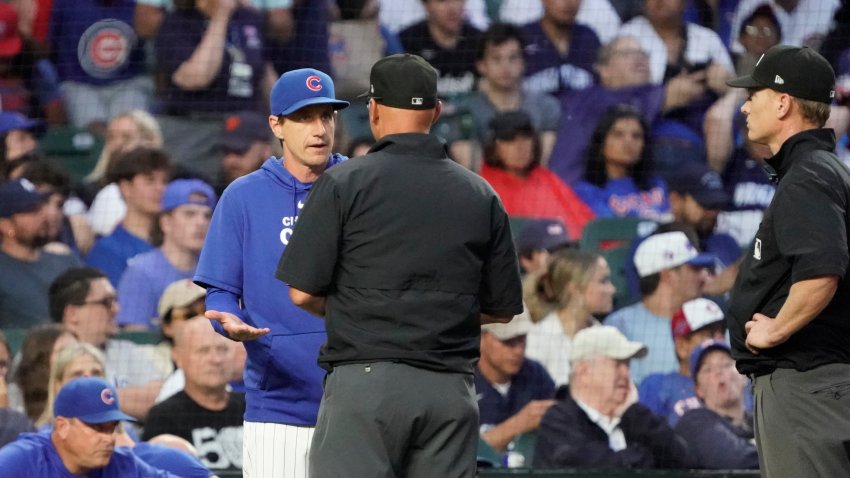 Jun 4, 2024; Chicago, Illinois, USA; Chicago Cubs manager Craig Counsell (30) argues a call with umpire Vic Carapazza (19) during the fourth inning at Wrigley Field. Mandatory Credit: David Banks-USA TODAY Sports