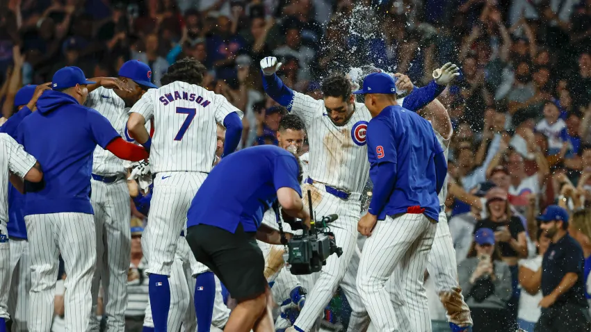 Jun 5, 2024; Chicago, Illinois, USA; Chicago Cubs outfielder Mike Tauchman (40) celebrates with teammates after hitting a walk-off home run against the Chicago White Sox during the ninth inning at Wrigley Field. Mandatory Credit: Kamil Krzaczynski-USA TODAY Sports