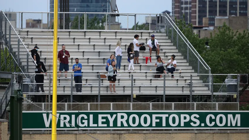 CHICAGO, ILLINOIS – AUGUST 01: Fans watch from the rooftops across the street from Wrigley Field as the Chicago Cubs take on the Pittsburgh Pirates on August 01, 2020 in Chicago, Illinois. (Photo by Jonathan Daniel/Getty Images)