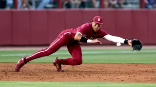 TALLAHASSEE, FL – APRIL 09: Third baseman Cam Smith #24 of the Florida State Seminoles dives for a grounder during the game against the Florida Gators on Mike Martin Field at Dick Howser Stadium on April 9, 2024 in Tallahassee, Florida. The #10 Seminoles defeated the #24 Gators  19 to 4. (Photo by Don Juan Moore/Getty Images)