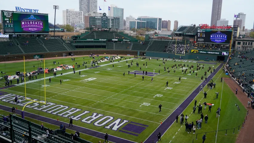 Nov 4, 2023; Chicago, Illinois, USA; Players warm up before the game between the Northwestern Wildcats and the Iowa Hawkeyes at Wrigley Field. Mandatory Credit: David Banks-USA TODAY Sports