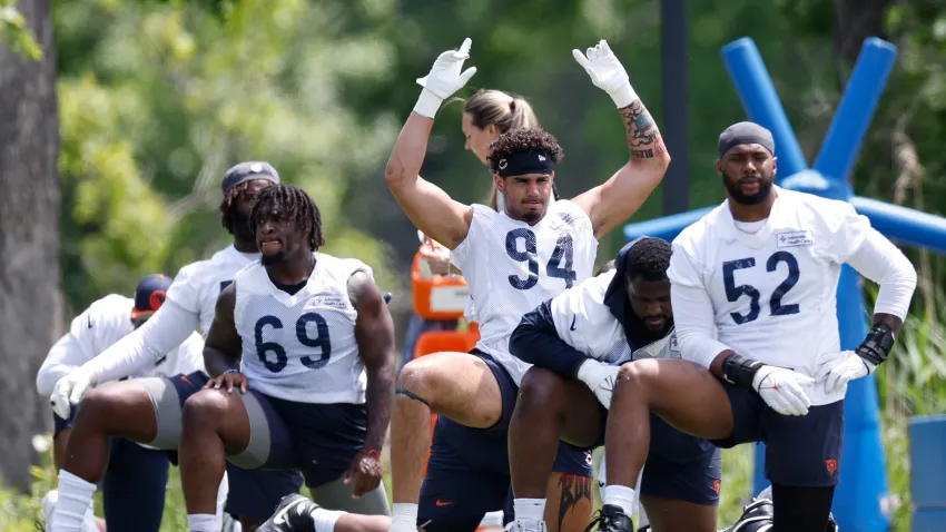 May 31, 2024; Lake Forest, IL, USA; Chicago Bears defensive lineman Austin Booker (94) warms up during organized team activities at Halas Hall. Mandatory Credit: Kamil Krzaczynski-USA TODAY Sports