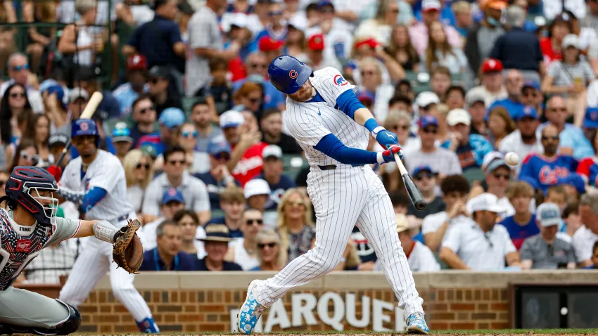 Jul 4, 2024; Chicago, Illinois, USA; Chicago Cubs outfielder Ian Happ (8) hits a three-run home run against the Philadelphia Phillies during the fourth inning at Wrigley Field. Mandatory Credit: Kamil Krzaczynski-USA TODAY Sports