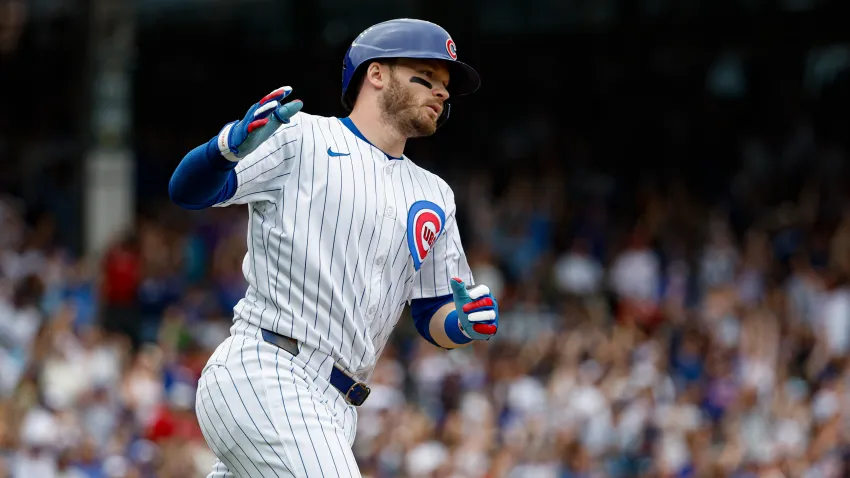 Jul 4, 2024; Chicago, Illinois, USA; Chicago Cubs outfielder Ian Happ (8) rounds the bases after hitting a three-run home run against the Philadelphia Phillies during the fourth inning at Wrigley Field. Mandatory Credit: Kamil Krzaczynski-USA TODAY Sports