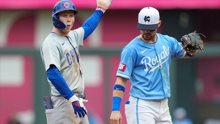 Jul 28, 2024; Kansas City, Missouri, USA; Chicago Cubs center fielder Pete Crow-Armstrong (52) celebrates after advancing to second base against Kansas City Royals second baseman Michael Massey (19) during the eighth inning at Kauffman Stadium. Mandatory Credit: Jay Biggerstaff-USA TODAY Sports