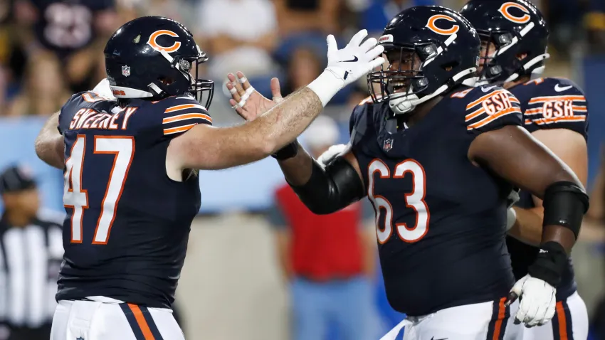 Aug 1, 2024; Canton, Ohio, USA;  Chicago Bears linebacker Micah Baskerville (47) celebrates his touchdown with guard Jerome Carvin (63) against the Houston Texans during the second quarter at Tom Benson Hall of Fame Stadium. Mandatory Credit: Charles LeClaire-USA TODAY Sports