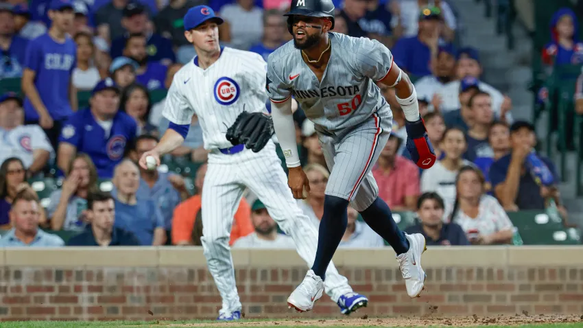 Aug 5, 2024; Chicago, Illinois, USA; Minnesota Twins second baseman Willi Castro (50) reacts after scoring against the Chicago Cubs during the third inning at Wrigley Field. Mandatory Credit: Kamil Krzaczynski-USA TODAY Sports