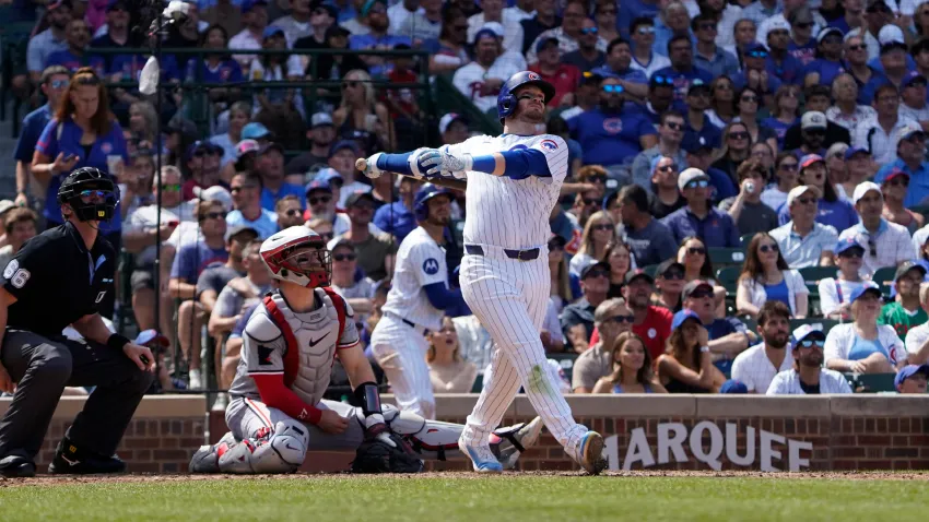 Aug 7, 2024; Chicago, Illinois, USA; Chicago Cubs outfielder Ian Happ (8) hits a two-run home run against the Minnesota Twins during the fourth inning at Wrigley Field. Mandatory Credit: David Banks-USA TODAY Sports