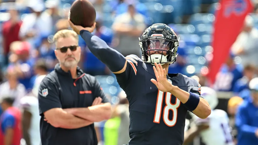 Aug 10, 2024; Orchard Park, New York, USA; Chicago Bears quarterback Caleb Williams (18) throws a pass in warm ups with head coach Matt Eberflus looking on before a pre-season game against the Buffalo Bills at Highmark Stadium. Mandatory Credit: Mark Konezny-USA TODAY Sports