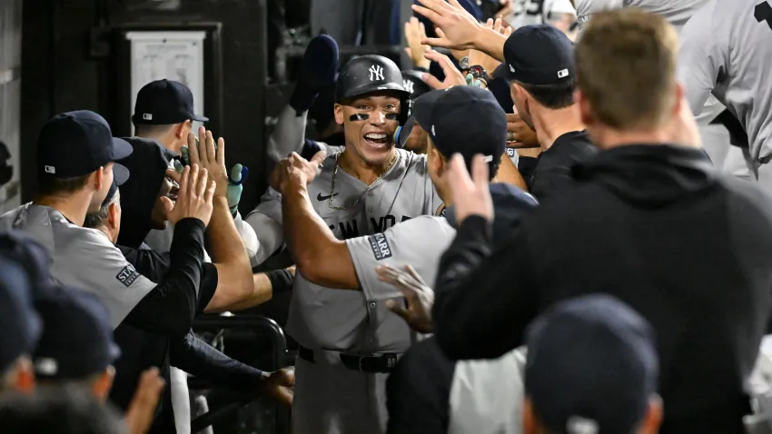 Aug 14, 2024; Chicago, Illinois, USA;  New York Yankees outfielder Aaron Judge (99) celebrates in the dugout after he hits his 300th home run during the eighth inning against the Chicago White Sox at Guaranteed Rate Field. Mandatory Credit: Matt Marton-USA TODAY Sports