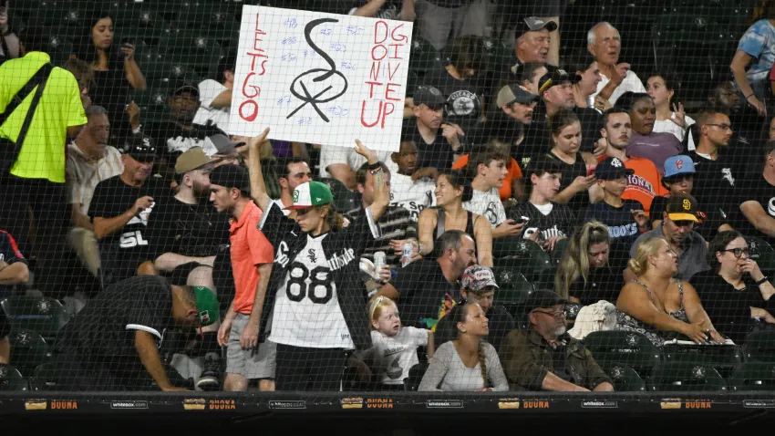 Aug 30, 2024; Chicago, Illinois, USA; A Chicago White Sox fan holds a s sign during the fifth inning against the New York Mets at Guaranteed Rate Field. Mandatory Credit: Matt Marton-USA TODAY Sports