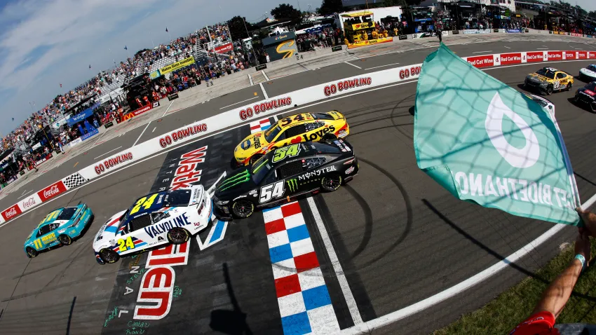 Denny Hamlin, driver of the No. 11 Mavis Toyota, leads the field to the green flag