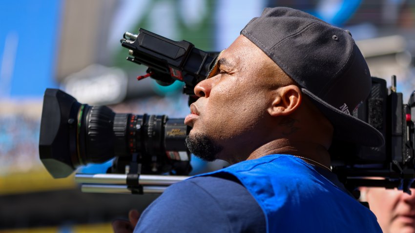 CHARLOTTE, NC – OCTOBER 29: Former Carolina Panthers Player Steve Smith operates a camera during a football game between the Carolina Panthers and the Houston Texans at Bank of America Stadium in Charlotte, North Carolina on Oct 29, 2023. (Photo by David Jensen/Icon Sportswire via Getty Images)