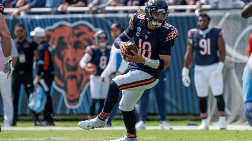 CHICAGO, IL – SEPTEMBER 08: Caleb Williams (18) of the Chicago Bears trips while preparing to throw the football during the game between the Tennessee Titans and the Chicago Bears at Soldier Field on September 8, 2024 in Chicago, Illinois. (Photo by Ben Hsu/Icon Sportswire via Getty Images)