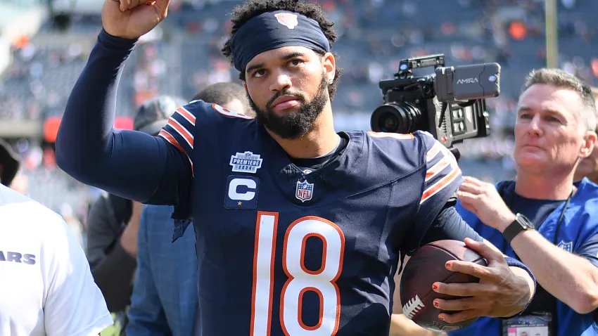 CHICAGO, ILLINOIS – SEPTEMBER 08: Caleb Williams #18 of the Chicago Bears celebrates after the game against the Tennessee Titans at Soldier Field on September 08, 2024 in Chicago, Illinois. The Bears defeated the Titans 24-17. (Photo by Quinn Harris/Getty Images)