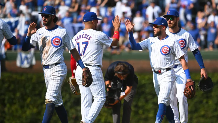 CHICAGO, ILLINOIS – SEPTEMBER 08: (L-R) Dansby Swanson #7 Isaac Paredes #17 and Miles Mastrobuoni #20 and Cody Bellinger #24 of the Chicago Cubs celebrate their team win over the New York Yankees at Wrigley Field on September 08, 2024 in Chicago, Illinois. The Cubs defeated the Yankees 2-1. (Photo by Nuccio DiNuzzo/Getty Images)