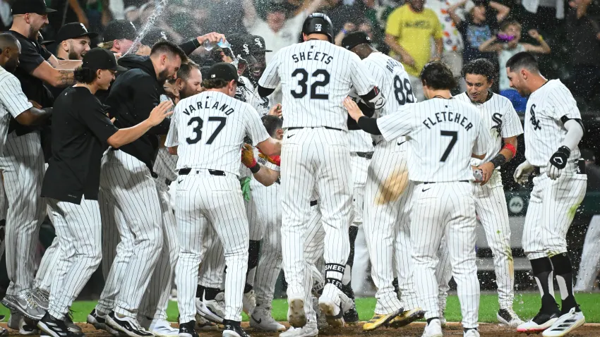 CHICAGO, ILLINOIS – SEPTEMBER 14: Andrew Benintendi #23 of the Chicago White Sox is congratulated by teammates following his walk-off home run in the ninth inning of a game against the Oakland Athletics at Guaranteed Rate Field on September 14, 2024 in Chicago, Illinois. The White Sox defeated the Athletics 7-6. (Photo by Nuccio DiNuzzo/Getty Images)