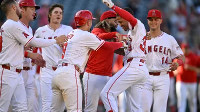 ANAHEIM, CALIFORNIA – SEPTEMBER 18: Jordyn Adams #39 of the Los Angeles Angels celebrates with his teammates after hitting a walk-off single to defeat the Chicago White Sox in the 13th inning at Angel Stadium of Anaheim on September 18, 2024 in Anaheim, California. (Photo by John McCoy/Getty Images)