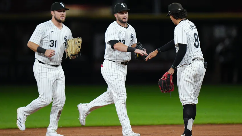 CHICAGO, IL – SEPTEMBER 24:   Zach DeLoach #31, Andrew Benintendi #23 and Nicky Lopez #8 of the Chicago White Sox celebrate a win after the game between the Los Angeles Angels and the Chicago White Sox at Guaranteed Rate Field on Tuesday, September 24, 2024 in Chicago, Illinois. (Photo by Matt Dirksen/MLB Photos via Getty Images)