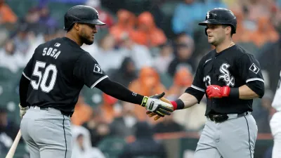 DETROIT, MI –  SEPTEMBER 28:  Andrew Benintendi #23 of the Chicago White Sox celebrates with Lenyn Sosa #50 after scoring against the Detroit Tigers in the sixth inning at Comerica Park on September 28, 2024 in Detroit, Michigan. (Photo by Duane Burleson/Getty Images)