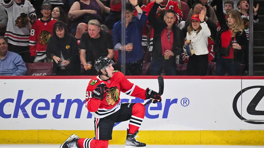 Apr 14, 2024; Chicago, Illinois, USA; Chicago Blackhawks forward Frank Nazar (91) celebrates after scoring his first NHL goal in his NHL debut in the first period against the Carolina Hurricanes at United Center. Mandatory Credit: Jamie Sabau-USA TODAY Sports