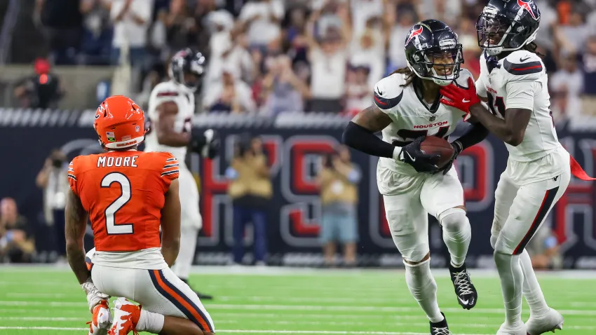 Sep 15, 2024; Houston, Texas, USA; Houston Texans cornerback Derek Stingley Jr. (24) celebrates his interception against Chicago Bears wide receiver DJ Moore (2) in the second half at NRG Stadium. Mandatory Credit: Thomas Shea-Imagn Images