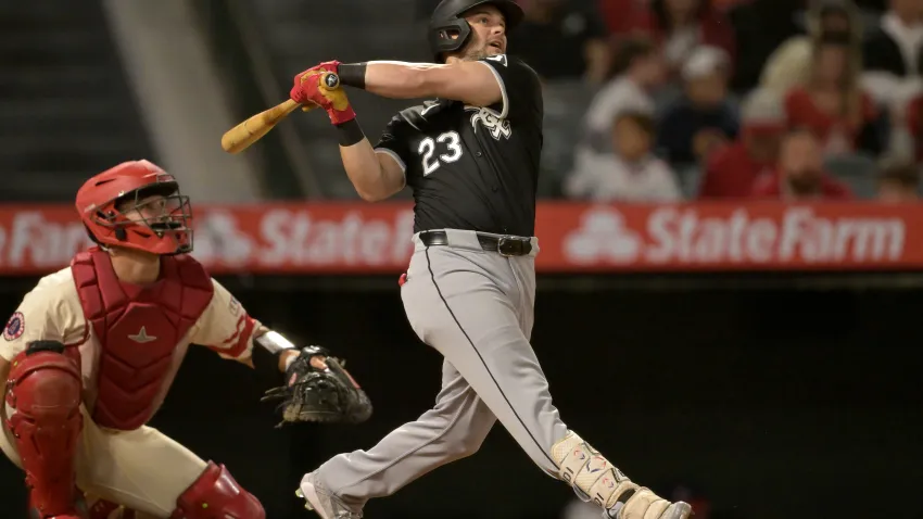 Sep 16, 2024; Anaheim, California, USA;  Chicago White Sox left fielder Andrew Benintendi (23) hits his second home run of the game, a solo shot, in the seventh inning against the Los Angeles Angels at Angel Stadium. Mandatory Credit: Jayne Kamin-Oncea-Imagn Images