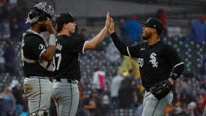 Sep 28, 2024; Detroit, Michigan, USA; Chicago White Sox third baseman Lenyn Sosa (50) high-fives pitcher Gus Varland (37) after defeating the Detroit Tigers at Comerica Park. Mandatory Credit: Brian Bradshaw Sevald-Imagn Images